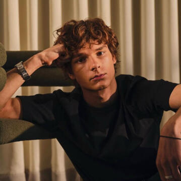 MASON THAMES as Aiden Whitmore, romantic interest